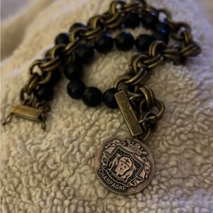 Chunky Black and Gold Bracelet with Champagne Medallion
